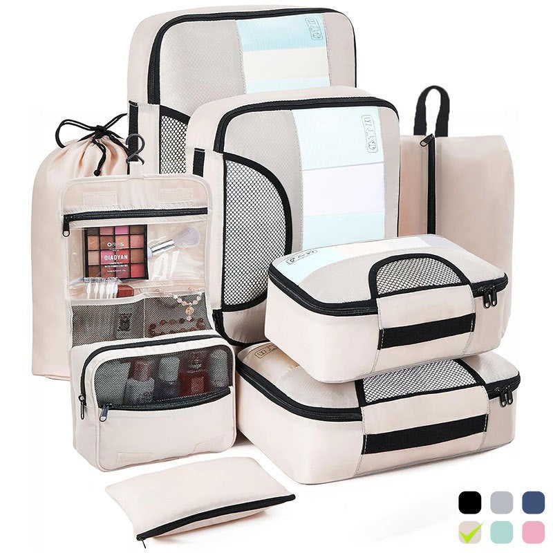 Organisateur de valise CubeFold™ 8 pièces : 4 cubes + trousse suspendue + sac linge → sac à dos. Twill durable, zip métal, mesh aéré. Valise rangée en 30s.