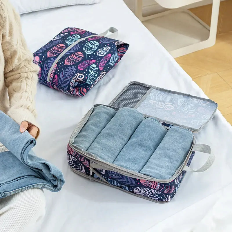 Organisateur de valise compression Élégance Voyage avec système de compression manuelle, set de 4 sacs pour optimiser l’espace en valise cabine et organiser efficacement les vêtements