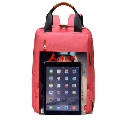 Sac à dos femme 25L en toile canvas – style urbain et fonctionnel avec multiples poches et compartiment pour ordinateur, parfait pour voyages courts et déplacements quotidiens.
