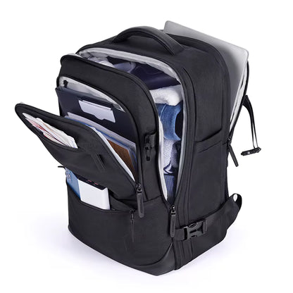 Sac à dos voyage Bag-Smart-RC noir ouvert, montrant les vêtements rangés, les poches avant et un ordinateur dans le compartiment arrière.