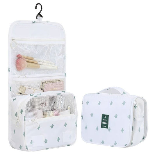 trousse de toilette voyage blanc a crochet avec compartiments multiples suspendue ouverte organisation produits toilette bagage cabine avion