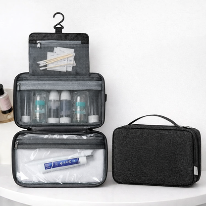 Trousse de toilette suspendue accrochée dans une salle de bain, solution pratique pour voyager et garder ses accessoires bien organisés - noir 3 compartiments